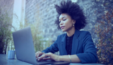 Woman looking for shareholder activism on her laptop