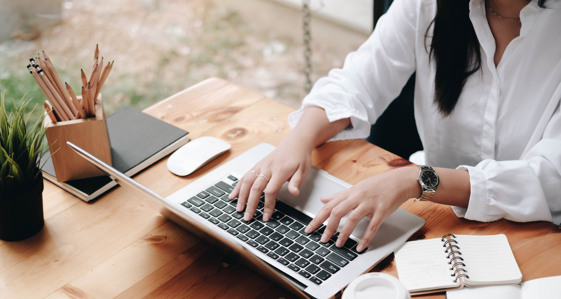 a person typing on a laptop